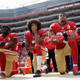 On Oct. 2, 2016, San Francisco 49ers outside linebacker Eli Harold, left, quarterback Colin Kaepernick, center, and safety Eric Reid kneel during the national anthem before the team’s NFL football game against the Dallas Cowboys in Santa Clara, Calif.
